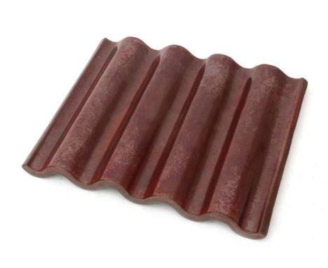 Jan van der Vaart (1931-2000) An oxblood-coloured glazed undulating rectangular shaped stoneware dish, produced in the artist