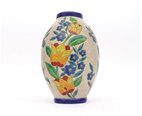 Charles Catteau (1880-1966) A glazed ceramic vase decorated with colourful stylized floral pattern and blue rim, on white gro