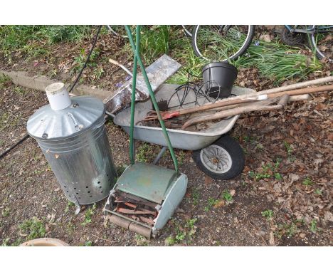 A GALVANISED FIRE TUB together with a metal wheel barrow, push along scarifier, wooden step ladders etc  (9)