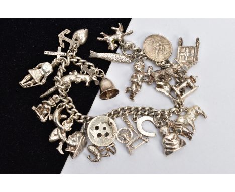 A WHITE METAL CHARM BRACELET, curb link bracelet fitted with twenty-four charms in forms such as a bell, spinning wheel, hors