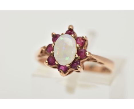 A 9CT GOLD OPAL AND GARNET CLUSTER RING, oval opal cabochon with circular shape garnet surround, hallmarked 9ct Birmingham 19