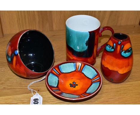 FOUR PIECES OF POOLE POTTERY, in Volcano pattern, comprising a mug, a small oval vase height 11cm, a spherical nut bowl with 