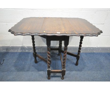 AN EARLY 20TH CENTURY OAK BARLEY TWIST GATE LEG TABLE, with pie crust edges, open length 103cm x closed length 39cm x depth 7