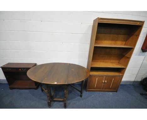 A MID CENTURY OAK GATE LEG TABLE, open length 134cm x closed length 44cm x depth 84cm x height 75cm, a low mahogany open book