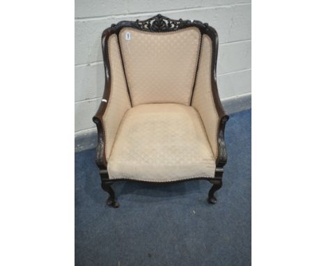 A LATE 19TH/EARLY 20TH CENTURY MAHOGANY TUB BEDROOM CHAIR, with carved cresting rail, swept armrests, on cabriole front legs 
