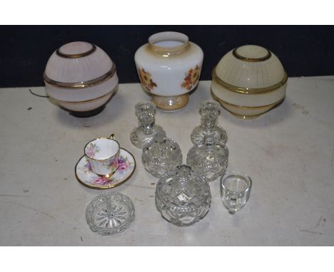 A TRAY CONTAINING GLASS WARE including a partial pressed glass dressing table set and three vintage light shades