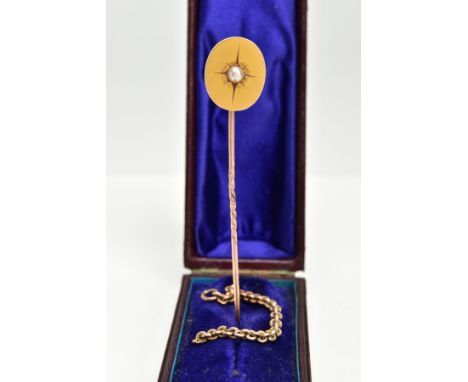 A YELLOW METAL STICK PIN AND PART CHAIN, a plain polished oval set with a cultured star set pearl, unmarked, together with a 