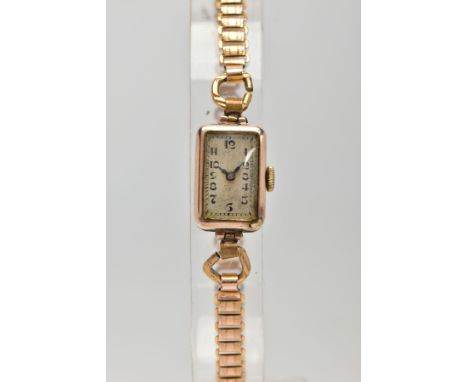 A LADIES 9CT GOLD WATCH, hand wound movement, rectangular discoloured dial, Arabic numerals, blue hands, within a plain polis