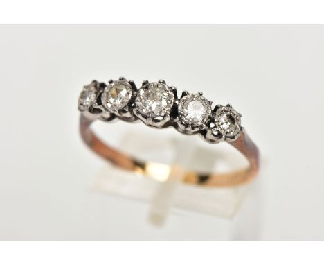 A YELLOW METAL FIVE STONE DIAMOND RING, designed with a row of five graduated illusion set old cut diamonds, estimated total 