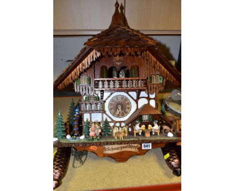 A SCHNEIDER MUSICAL CUCKOO CLOCK, the movement has either a cuckoo or bell strike action with a waterwheel to one side and da