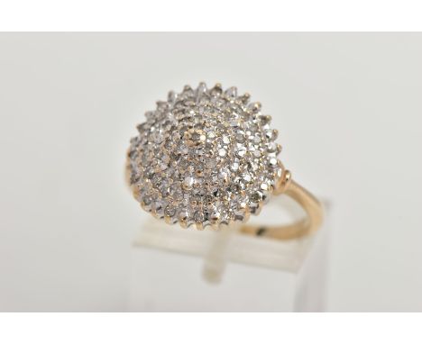 A 9CT GOLD DIAMOND CLUSTER RING, a circular cluster ring set with round brilliant cut diamonds in a white gold prong setting,
