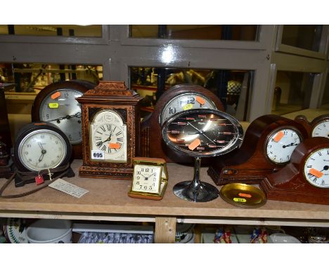 TWELVE ASSORTED MANTEL AND ALARM CLOCKS, including oak cased dome top mantel clocks, a Rhythm pedestal alarm clock, a brown b