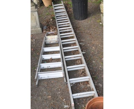 A 4M DOUBLE EXTENSION ALUMINIUM LADDERS together with a set of step ladders and a quantity of garden tools in a black bin (2)