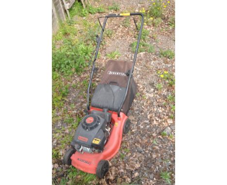 A CHAMPION PETROL LAWNMOWER with grass box  (engine pulls freely but not tested)