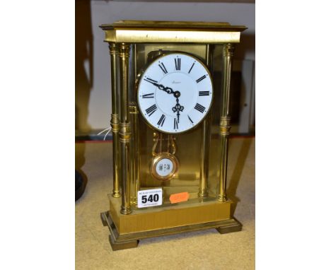 A MECHANICAL RAPPORT CHIMING MANTLE CLOCK, the white dial has Roman numeral hour markers, the case is of brass and glass cons