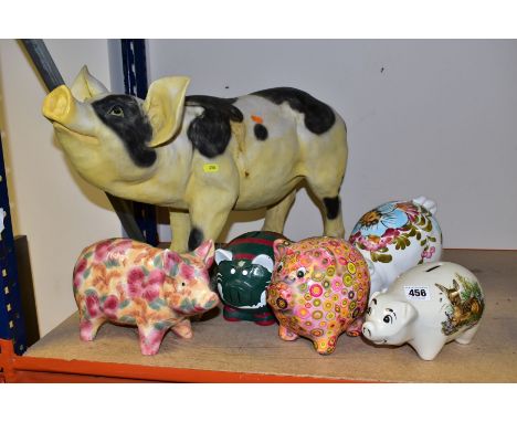 A COLLECTION OF FOUR CERAMIC AND RESIN PIGGY BANKS AND TWO OTHER PIG FIGURES, including a resin Leicester Tigers piggy bank a