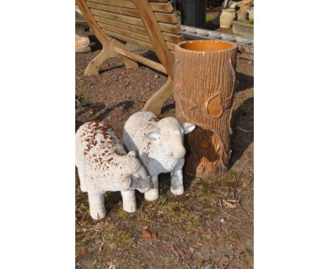 A TUBULAR TERRECOTA PLANTER in the style of a tree trunk, diameter 27cm x height 58cm together with a pair of resin sheep (3)