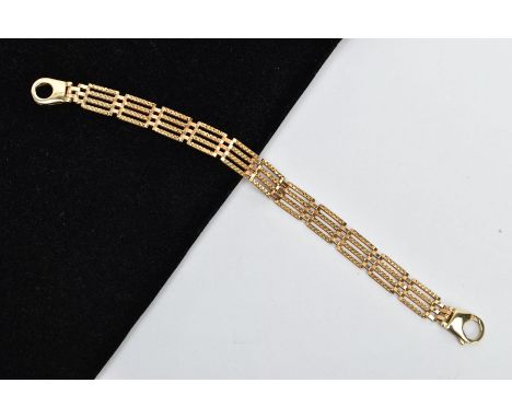 A 9CT GOLD GATE BRACELET, four bar gate bracelet diamond cut pattern to the one side the other a plain polished design, fitte
