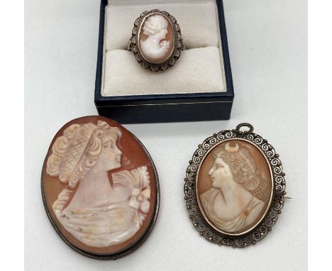 2 vintage silver mounted cameo brooches together with a silver cameo ring. Large cameo approx. 5cm x 3.75cm, with hanging bal