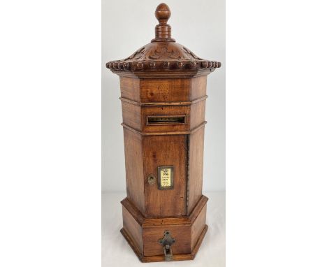 A wooden model of a replica Victorian hexagonal  post box. With carved detail to top and turned finial. Brass letter plate (o