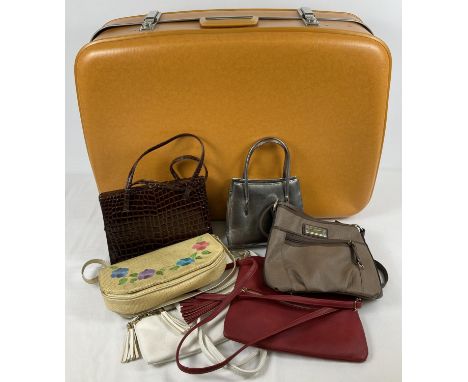 A vintage 1960's mustard coloured suitcase by Cheney. Check patterning fabric lining with interior elasticated pocket. Togeth