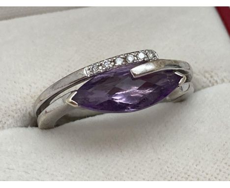 A modern contemporary style 9ct white gold dress ring set with amethyst &amp; diamonds. A double band style ring set with mar