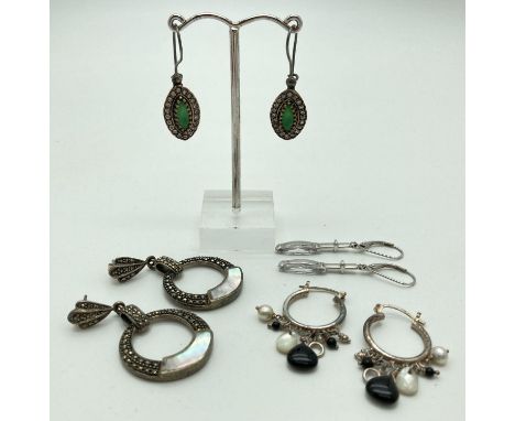 4 pairs of decorative stone set drop and hoop style earrings. A pair of circular drops set with mother of pearl and marcasite