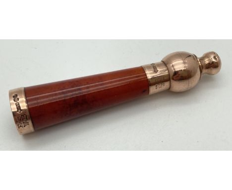 A vintage cheroot holder with 9ct rose gold mount and bulbous designed mouthpiece. Hallmarked for Edwin &amp; William Barling