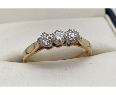 An 18ct gold .30ct diamond trilogy ring. Ring size N. Full hallmarks and makers mark to inside of band. Total weight approx. 