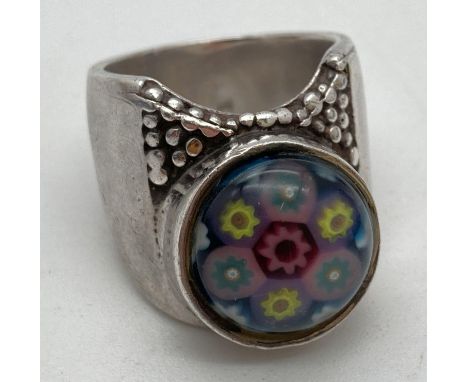 A Scottish silver Caithness Jewellery ring set with Millefiori glass cabochon. Hallmarked inside band. Ring size L. 