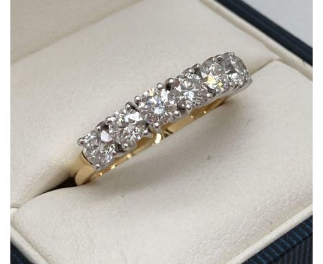An 18ct gold 1.45ct diamond half eternity style ring. Set with 7 round cut diamonds. Full hallmarks and diamond weight to ins