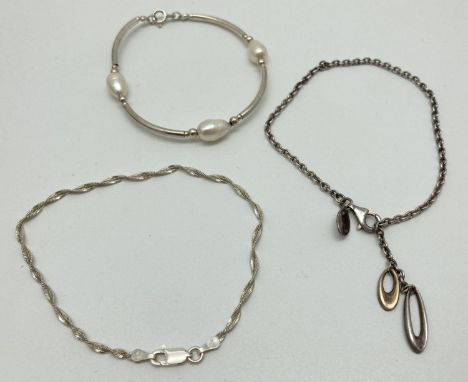 3 modern design silver bracelets. A twisted herringbone style chain bracelet, a belcher chain bracelet with two oval drops an