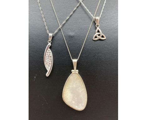 3 modern design silver pendant necklaces. A mother of pearl set pendant on an 18" fine curb chain; a crystal set twist design
