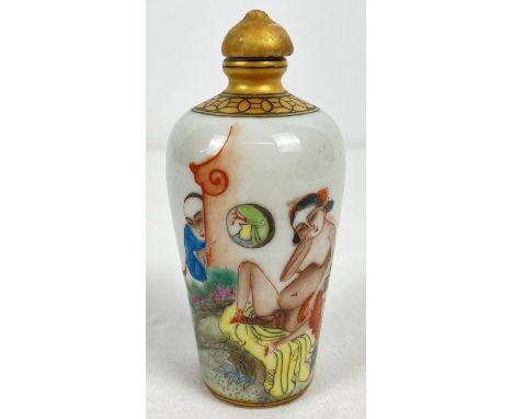 A small Chinese ceramic snuff bottle with painted erotic scene. Gilt painted stopper and top rim. Hand painted signature mark