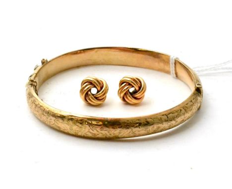 A 9ct gold bangle and a pair of 9ct gold knot earrings 11.84g gross.