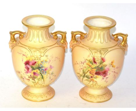 A pair of Royal Worcester blush ivory twin handled vases model no 1632