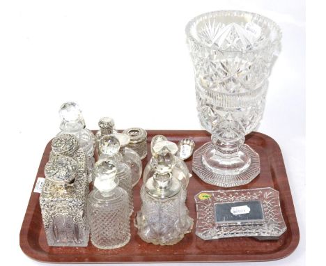 Silver mounted glass bottles, a silver caddy spoon, a cut glass vase, Waterford crystal picture frame and three glass jars