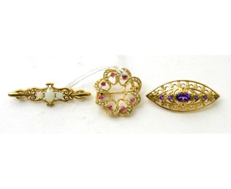 A 9ct gold seed pearl and ruby brooch, a 9ct gold opal brooch and an amethyst brooch (3) Seed pearl and ruby brooch - 5.31g g