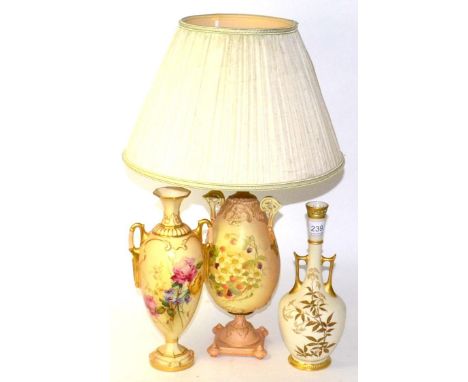 Two Royal Worcester blush ivory twin handled vases and a blush ivory lamp and shade