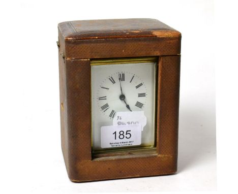 A French brass carriage clock in travel case