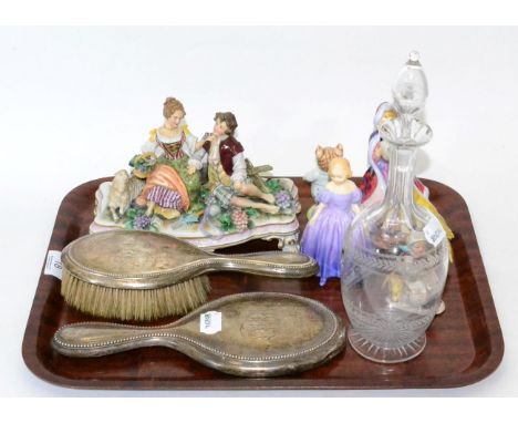 Tray including china figures, silver backed brush and mirror, etched glass decanter  