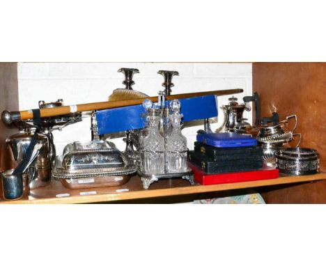 A shelf of plated wares, silver backed dressing table items, walking cane, two tin boxes etc