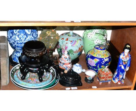 A shelf of Oriental items including ginger jars and covers, vases, dishes, printing block, jade type screen, etc