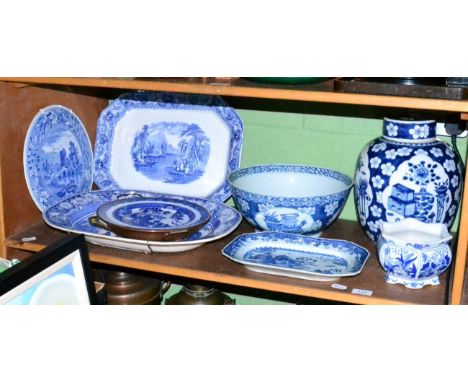 A shelf of assorted blue and white porcelain and pottery, English and Chinese 