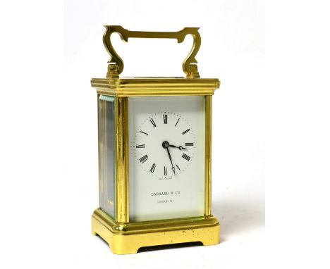 A Garrad & Co carriage clock with presentation plaque to door