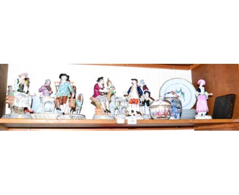 A shelf of decorative ceramics including Continental figures, Limoges plates, a Chinese ginger jar and cover, silver coffee b