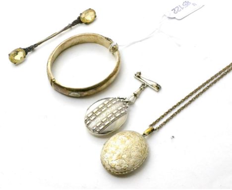 Two Victorian lockets, a silver bangle and a cloak pin 
