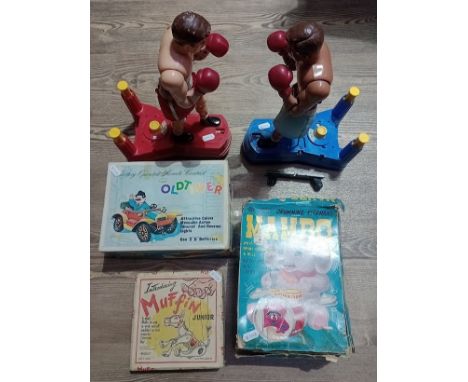 A box of vintage toys to include 2 boxing toys, a Muffin junior puppet, an Old-timer car and a Mambo drumming elephant.