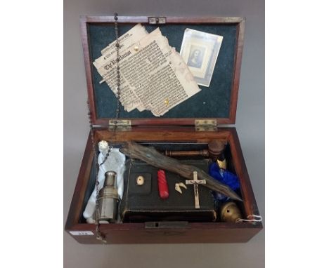 Theatrical prop; a marquetry inlaid box containing a 'vampire hunting kit' including stake, bible, crucifix, rosary beads, si