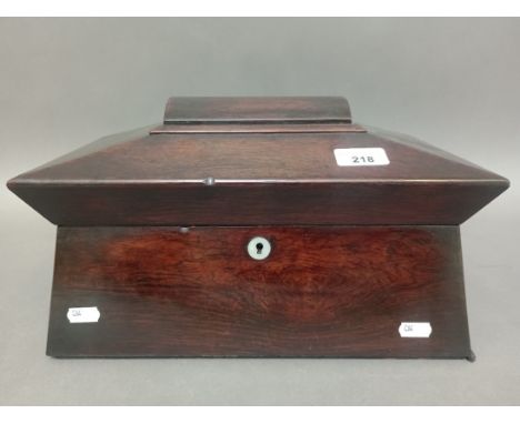 A 19th century rosewood sarcophagus tea caddy with mother of pearl escutcheon and ring handles. 